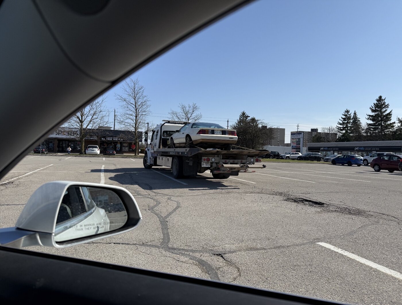 Jenny on the flatbed in a parking lot — tap to enlarge