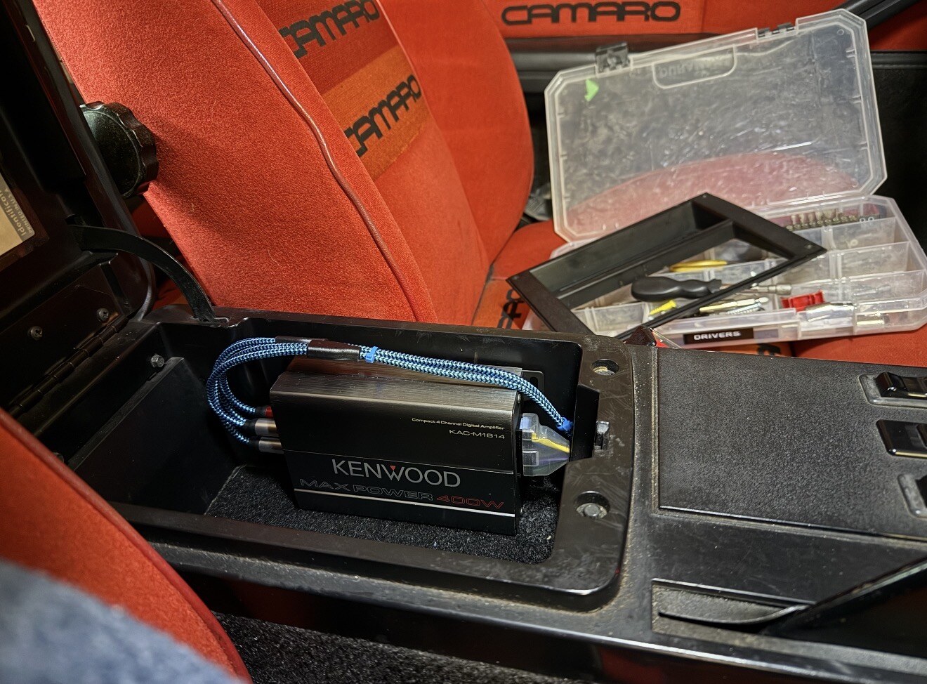 Kenwood amp installed in the center console bin